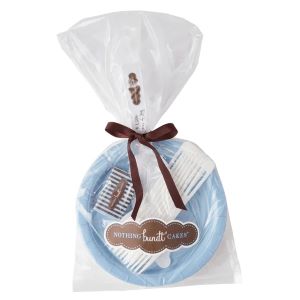 Blue plates with white forks and knives wrapped in plastic and tied with a brown bow.
