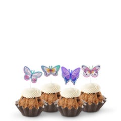 Oreo Cookies & Cream Bundtinis® topped with frosting and decorated with purple, green, pink sparkled butterflies.