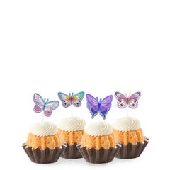 Bundtinis® topped with frosting and decorated with purple, green, pink sparkled butterflies.