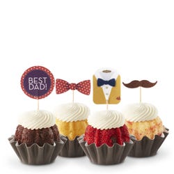 Cupcake-sized mini cakes with frosting and topped with bowties, mustaches and Best Dad! signs. 