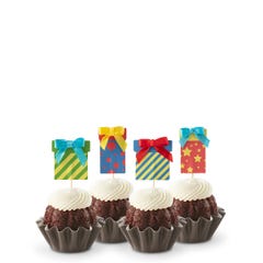 Cupcake-sized mini cakes with frosting and birthday present toppers with different celebratory designs.