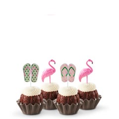 Mini bundt cakes decorated with a topper: from left to right, there's a pair of green tropical flip-flops, a pink flamingo, another pair of pink flip-flops with green straps, and another pink flamingo.