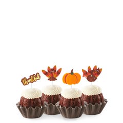 New! Chocolate Chocolate Chip Thankful Turkey Bundtinis® topped with frosting and decorated with pumpkin and turkey toppers as well as a topper with Thankful written in cursive. 