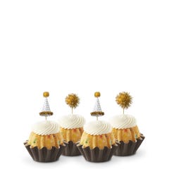 Mini Bundt cakes adorned with festive party hat toppers and golden pom-poms themed for a New Year's celebration.