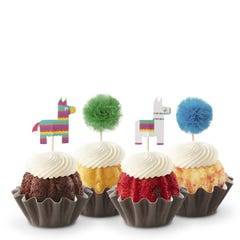 Cupcake like bundt cakes with frosting and decorated with party pinatas and poms. 