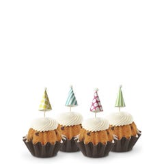 Dotted party hats top the frosting covered mini bundt cakes.