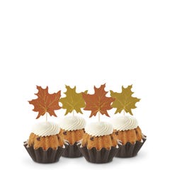 Gluten Free Chocolate Chip Cookie flavored mini cakes with frosting and decorated with fall leaves toppers. 