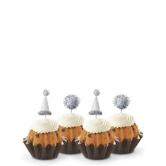 Gluten-Free Chocolate Chip Cookie mini Bundt cakes (Bundtinis®) each topped with creamy white frosting and adorned with silver party hats and matching silver pom-poms.