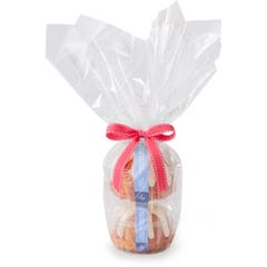 Two Gluten-Free Lemon Raspberry Bundtlets gift wrapped in cellophane and tied with pink ribbon.