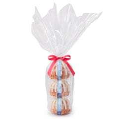 Three Gluten-Free Lemon Raspberry Bundtlets gift wrapped in cellophane and tied with pink ribbon.