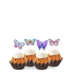 Gluten Free Bundtinis® topped with frosting and decorated with purple, green, pink sparkled butterflies.