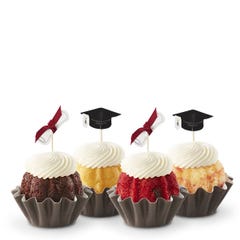 Cupcake-sized bundt cakes adorned with small toppers with a black graduation cap and  a diploma tied with a red ribbon