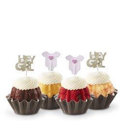 Mini cakes decorated with a pink baby onesie and Hey Girl toppers.