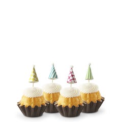 Dotted party hats top the frosting covered mini bundt cakes.