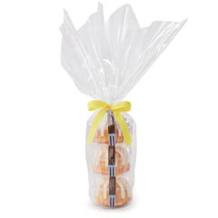 Three personal-size Lemon bundt cakes stacked vertically, packaged in a plastic container and gift-wrapped in cellophane. 