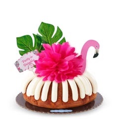 Lemon Raspberry Party in Paradise decorated with a Flamingo, tropical leaves and hot pink bow