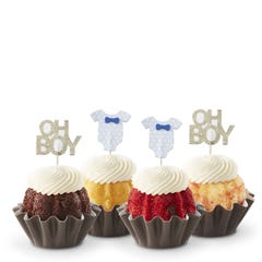 Mini cakes decorated with a blue baby onesie and Oh Boy toppers.