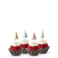 Dotted party hats top the frosting covered mini bundt cakes.