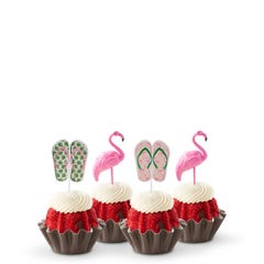 Mini bundt cakes decorated with a topper: from left to right, there's a pair of green tropical flip-flops, a pink flamingo, another pair of pink flip-flops with green straps, and another pink flamingo.