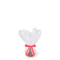 Personal size Red Velvet bundt cake, packaged in a plastic container and gift-wrapped in cellophane. 