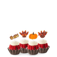 New! Red Velvet Thankful Turkey Bundtinis® topped with frosting and decorated with pumpkin and turkey toppers as well as a topper with Thankful written in cursive. 