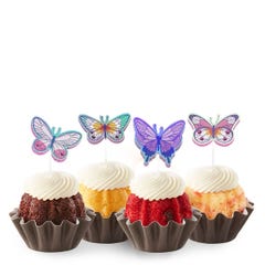 Bundtinis® topped with frosting and decorated with purple, green, pink sparkled butterflies.