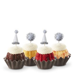 Mini Bundt cakes (Bundtinis®) each topped with creamy white frosting and adorned with silver party hats and matching silver pom-poms.