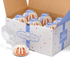 A box filled with 12 individually packaged Strawberries & Cream bundtlets. 
