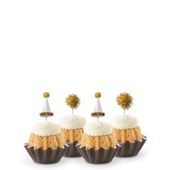 Mini Bundt cakes adorned with festive party hat toppers and golden pom-poms themed for a New Year's celebration.