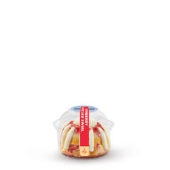 One individually packaged Key Lime Bundtlet gift wrapped in cellophane with a blue stitched ribbon.