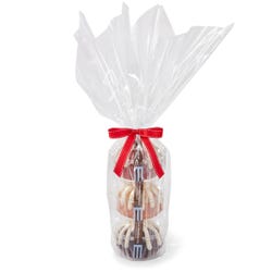 Three personal-size bundt cakes stacked vertically, packaged in a plastic container and gift-wrapped in cellophane. 