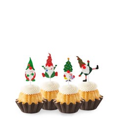 Vanilla mini bundt cakes topped with four Christmas-themed gnome decorations: one in green with a mistletoe, one in red with a tree, one in stripes with a gift, and one in red and white.