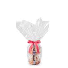 Two personal-size White Chocolate Raspberry bundt cakes stacked vertically, packaged in a plastic container and gift-wrapped in cellophane. 
