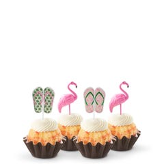 Mini bundt cakes decorated with a topper: from left to right, there's a pair of green tropical flip-flops, a pink flamingo, another pair of pink flip-flops with green straps, and another pink flamingo.