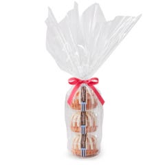 Three personal-size White Chocolate Raspberry bundt cakes stacked vertically, packaged in a plastic container and gift-wrapped in cellophane. 