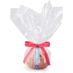 Individual Gluten-Free Lemon Raspberry Bundtlet gift wrapped in cellophane and tied with a pink ribbon.